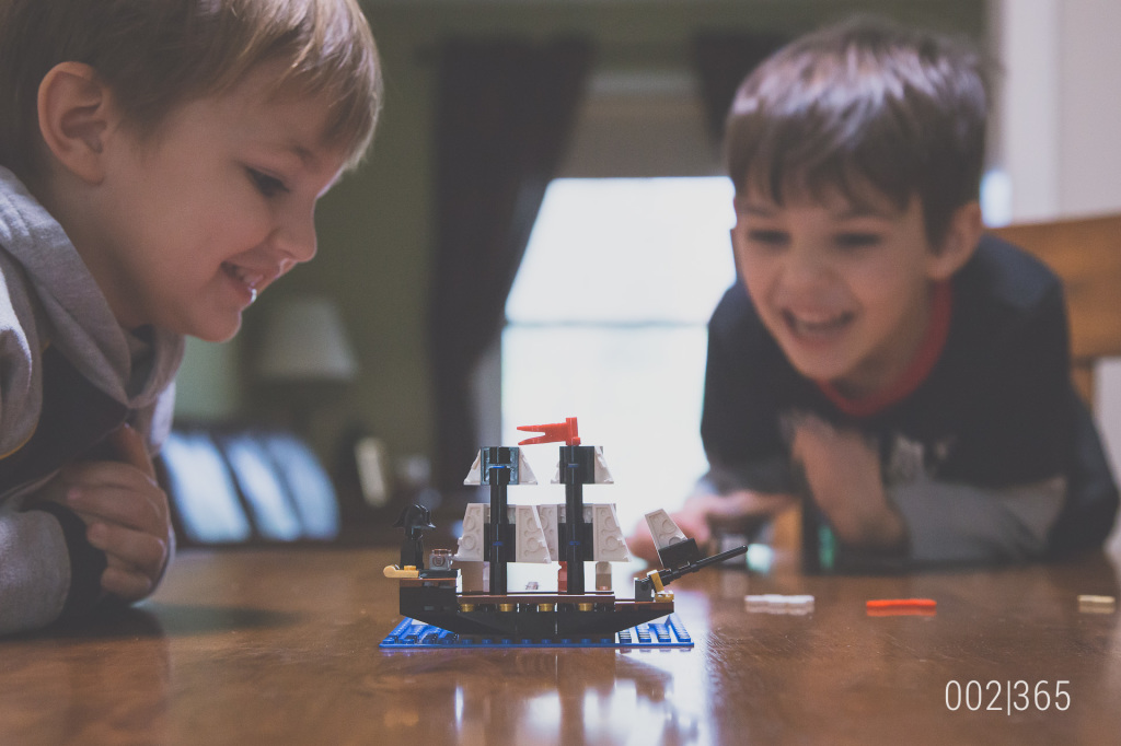 the morning after our company left, we decided to play a new lego game we got from grandma & grandpa.  fun times!