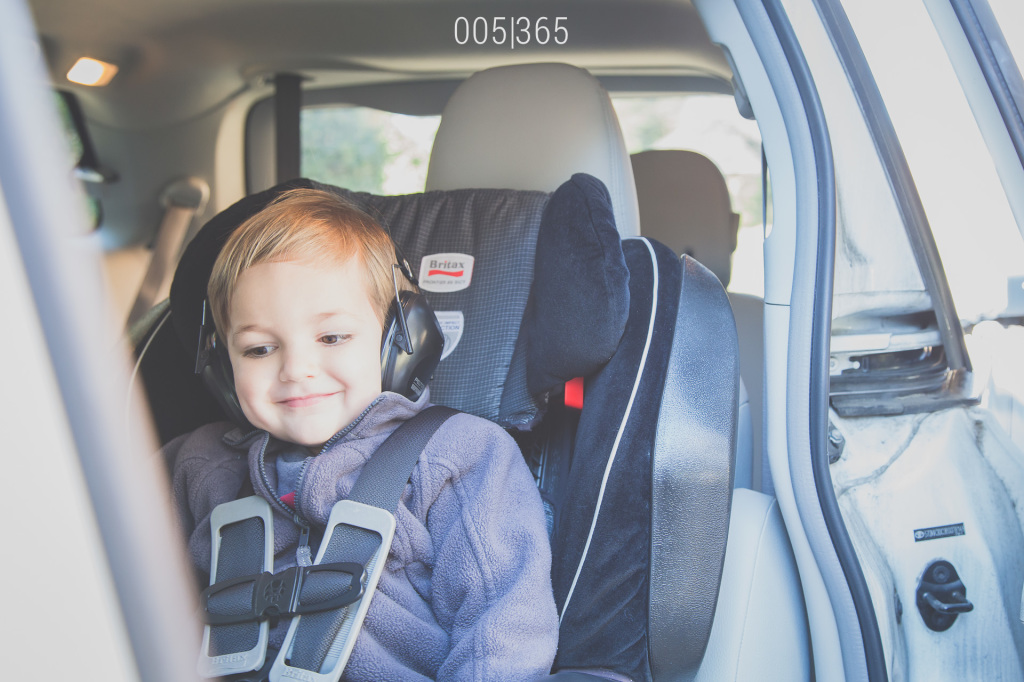 this guy has always had a flair for accessories.  today, he chose ear protection for the ride to pick up his brother from school.  i fall deeper in love every day.