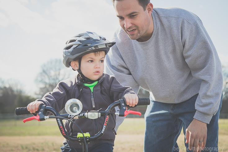 the face of determination {and the reassurance of having daddy close by}.  we headed to the school yard to practice riding without training wheels for this little one.  