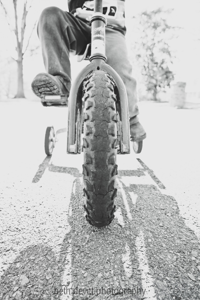 and so this is what you get when you ask a little guy to stop on his bike so that you can take his picture on a lovely, warm, sunny day.  