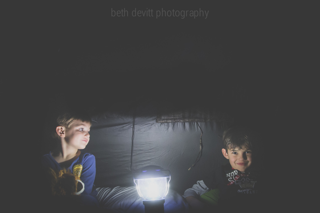 every now and again, we let the boys 'camp out' inside.  we put up a little tent, blow up the air mattresses, and they get to hang out and pretend they are camping out all by themselves.  tonight was one of those nights, and i simply adore how lovingly my little guy is looking at his big brother.  he adores that big guy, and it makes my heart so very happy.