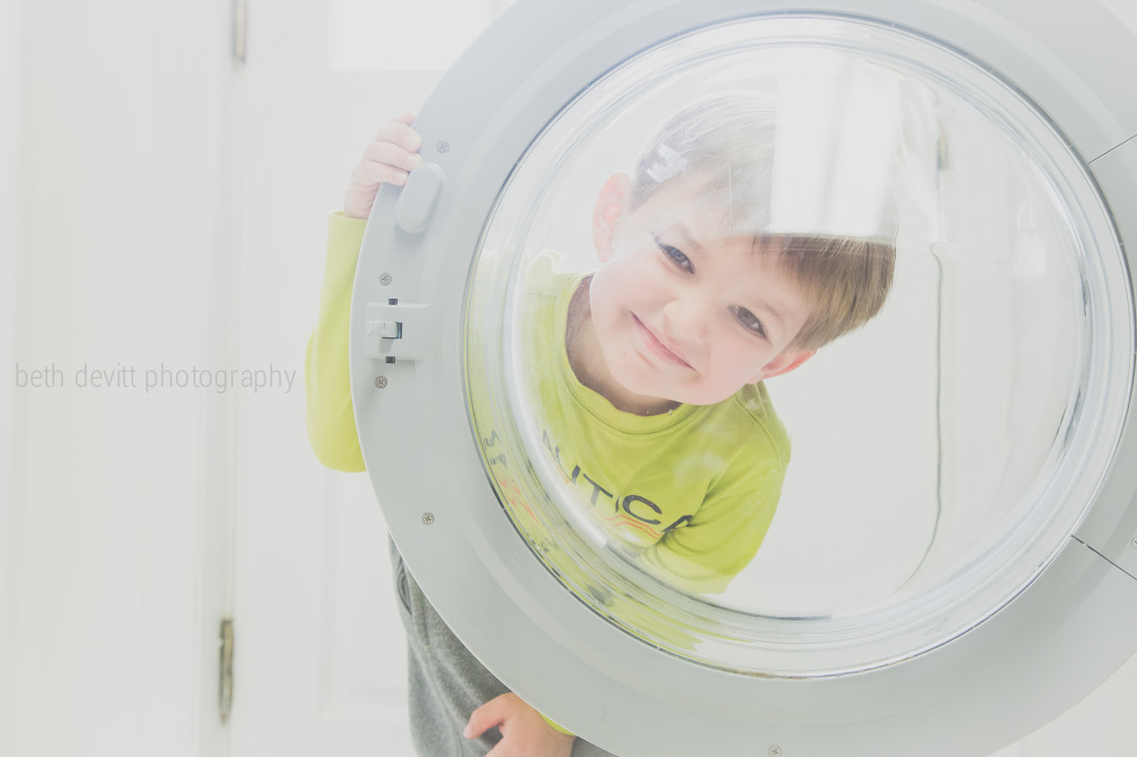 he loves to help me do laundry.  he always wants to 'push the buttons'.  and how do you say no to that cute face?!?