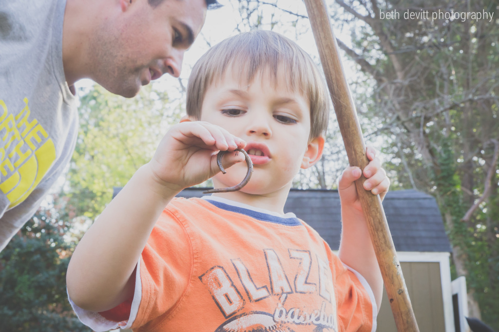 not a technically amazing photo, but this is representative of our day.  he worked outside with his dad all day long.  they tended to the garden and he decided to inspect each earthworm they found.  