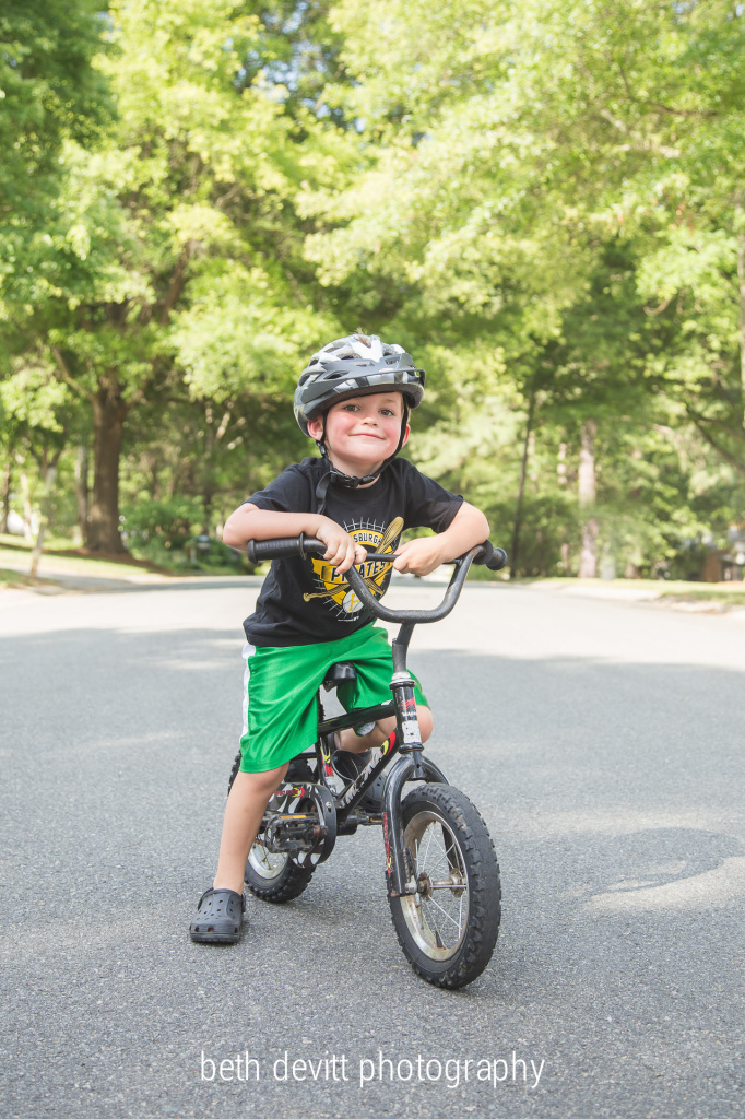 he first rode without training wheels on christmas day.  since then, he has been hesitant about it.  yesterday, he finally decided that it was time, and he zipped around without any help. he didn't stop smiling all night.  