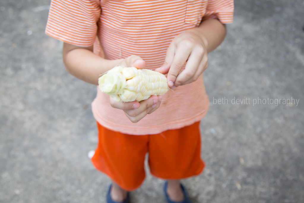 two of my favorite things {and his first time schucking corn!}.