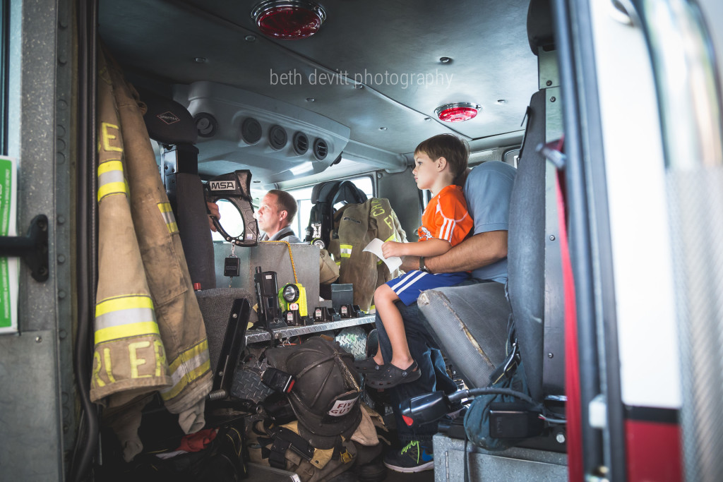 we met daddy uptown for lunch.  some firemen sat and ate next to us.  gray stared at them the entire time that he ate his lunch.  and then they invited him to explore their truck, and he completely froze.  