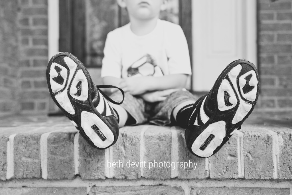 cleats.  his new favorite thing.