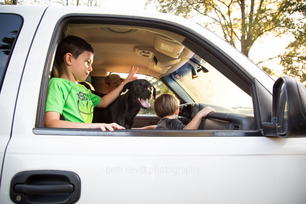 their new favorite thing: cruisin'.  {or just sitting in the front seat of dad's truck with the radio up loud}.  ;)