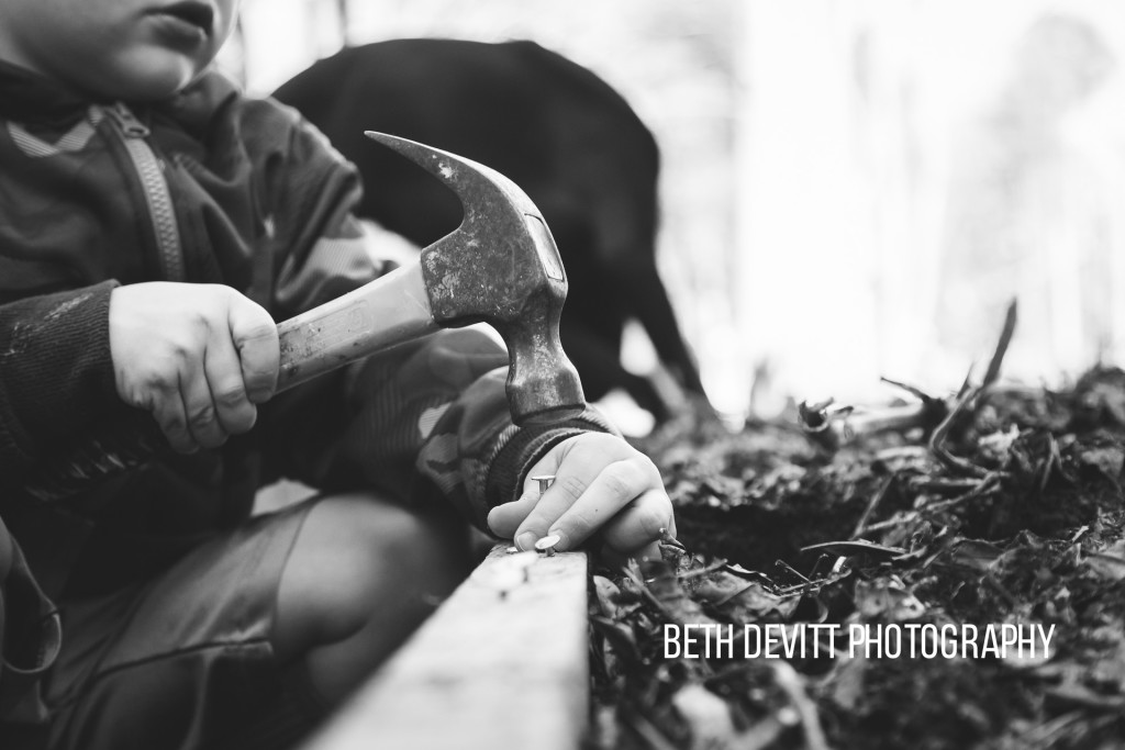 he wants to be a 'worker man' when he grows, so when his daddy has his tools out, he always gravitates to the hammer and nails.  