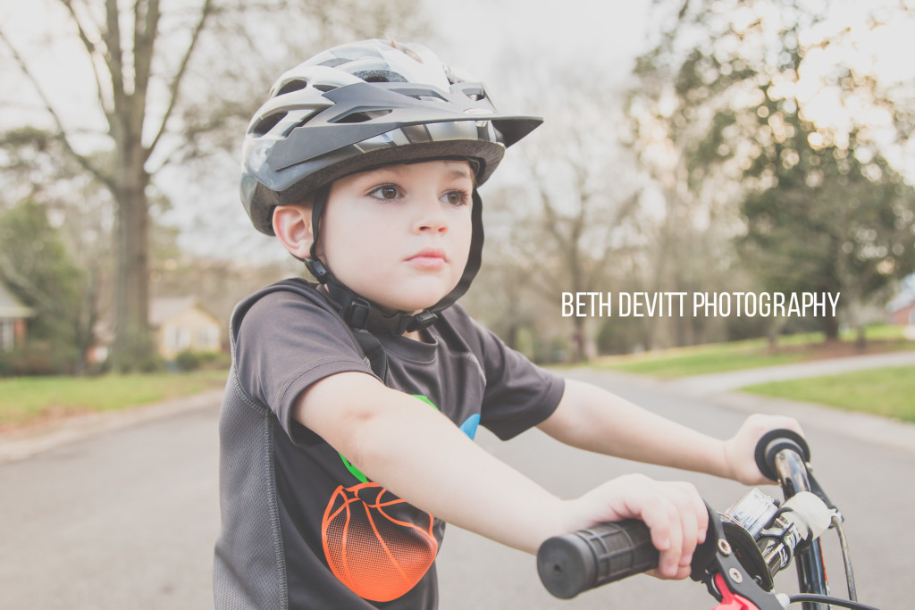 i took a photo of this guy on his bike on christmas day last year.  same bike, same sweet face +1 day.  